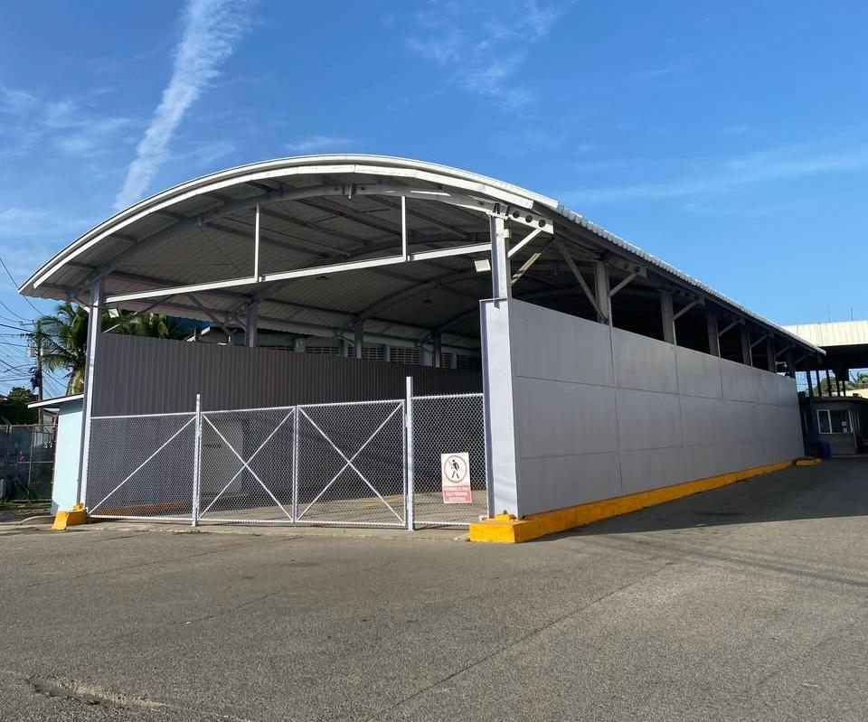 Exterior of Hangar 9 in the Colón Free Trade Zone after sanding and anticorrosive repainting